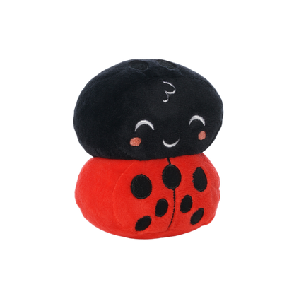 Plush ladybug toy with a black head, red body, black spots, and a smiling embroidered face.