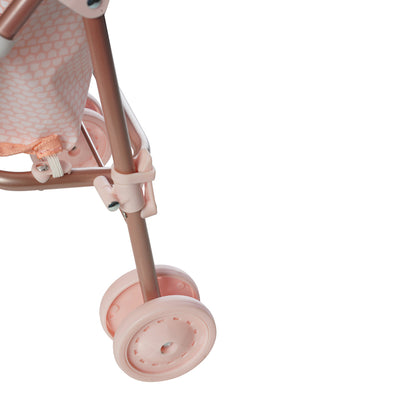 A close up of the latch to collapse a pink doll stroller. 