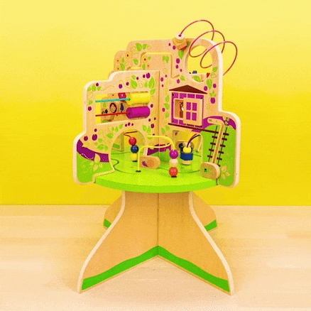 Colorful tree-shaped activity table for toddlers with beads, tracks, and various interactive elements on a yellow background.