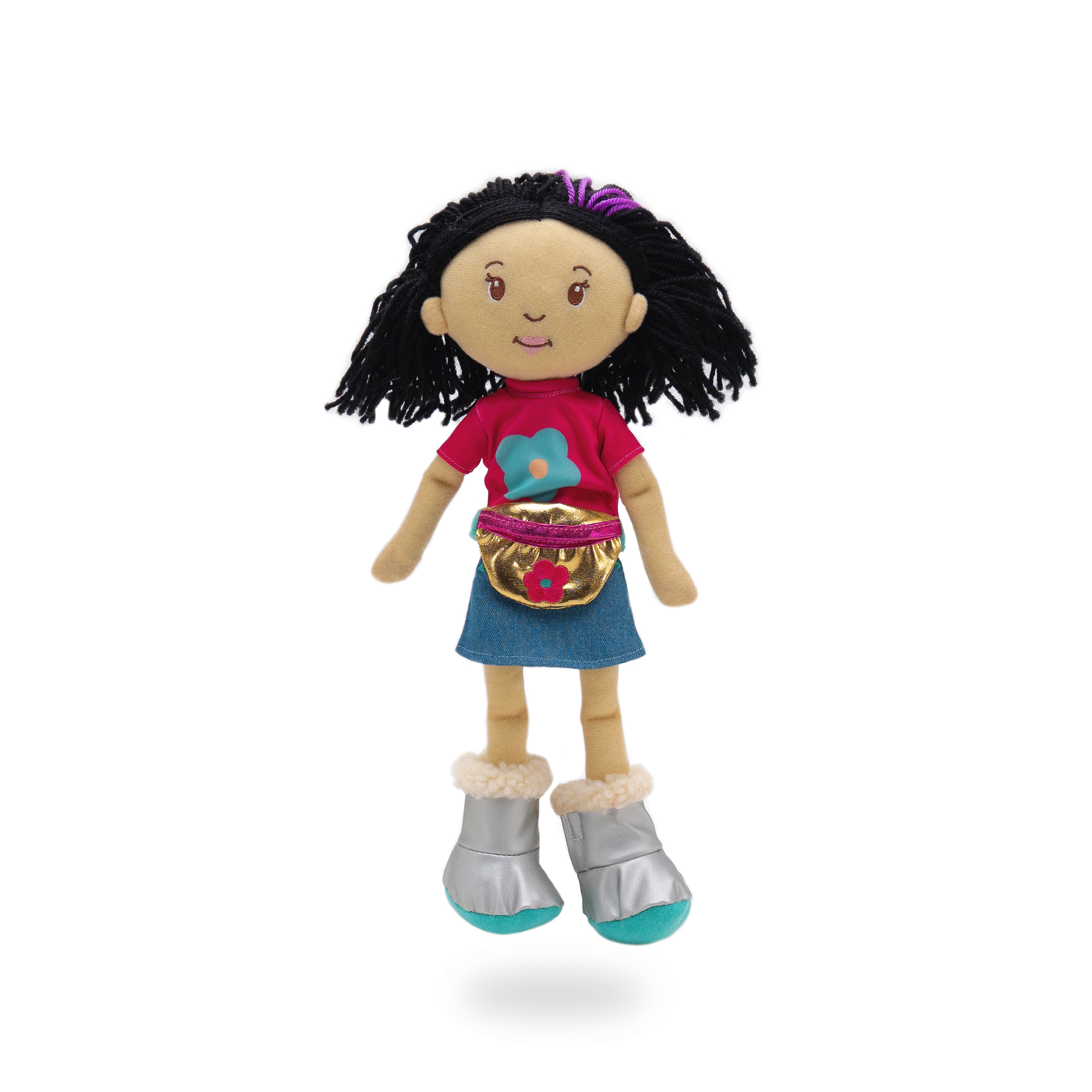Soft doll wearing pink shirt with blue flower, denim skirt, silver boots, and gold waist bag.