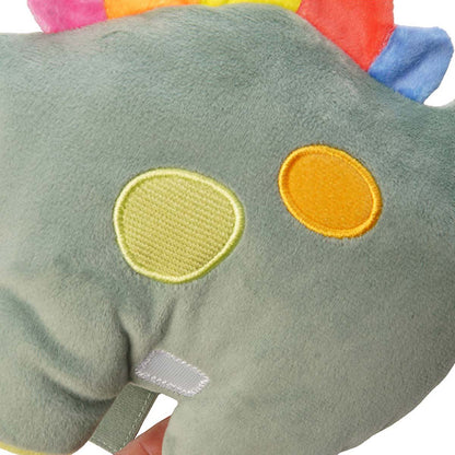 Close up of colorful textured spots on green dinosaur's side.